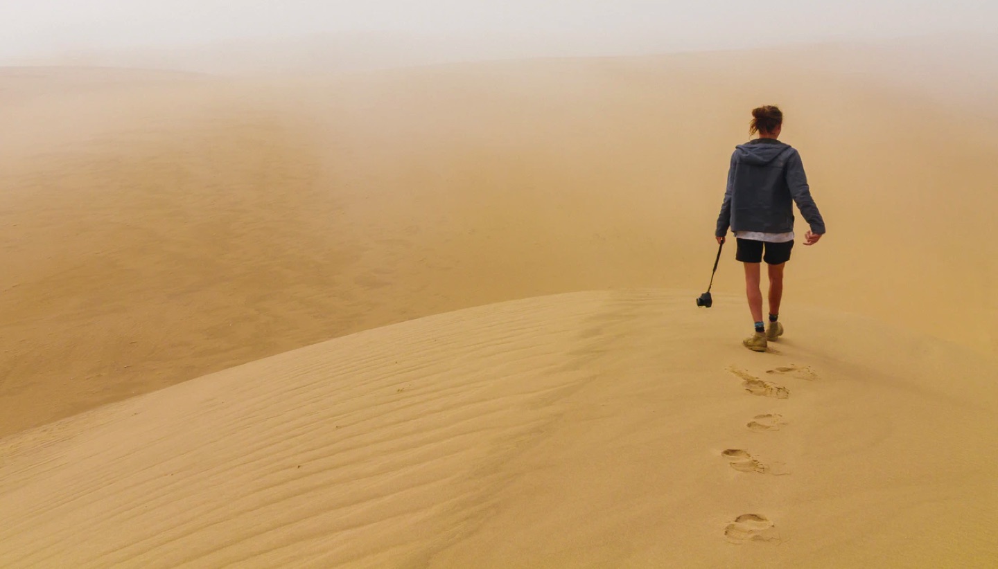 Person walking through desert